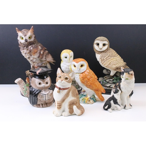 91 - Four owl figurines to include Beswick number 1046 an owl teapot and two resin cat figures