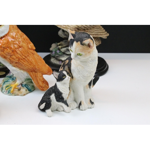 91 - Four owl figurines to include Beswick number 1046 an owl teapot and two resin cat figures