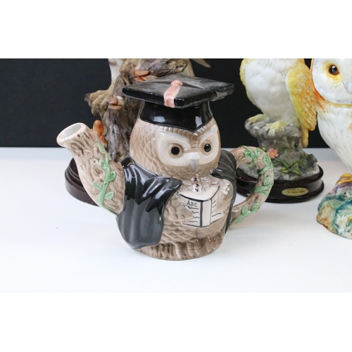 91 - Four owl figurines to include Beswick number 1046 an owl teapot and two resin cat figures