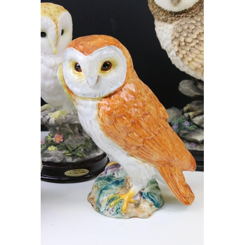 91 - Four owl figurines to include Beswick number 1046 an owl teapot and two resin cat figures