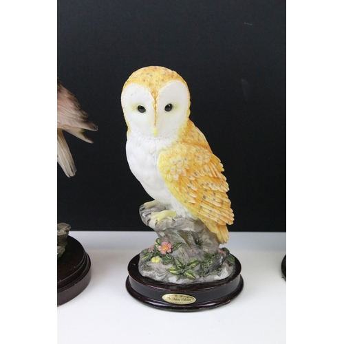 91 - Four owl figurines to include Beswick number 1046 an owl teapot and two resin cat figures