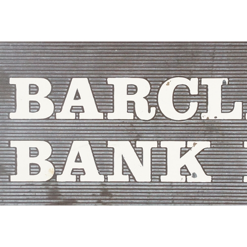 138 - Barclays Bank PLC metal wall sign with white enamelled lettering. Measures 24 x 31.5cm.