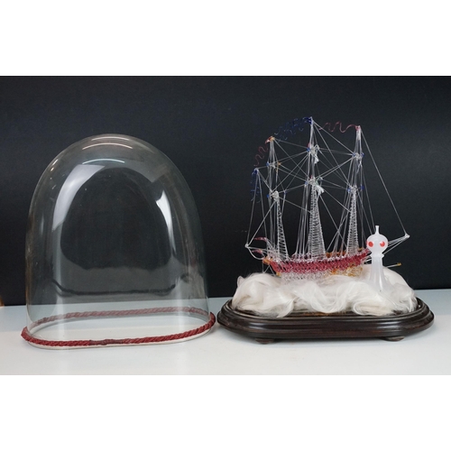 146 - 19th Century Victorian glass frigger sailing ship diorama having a glass blown ship upon a bed of wa... 