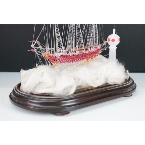 146 - 19th Century Victorian glass frigger sailing ship diorama having a glass blown ship upon a bed of wa... 