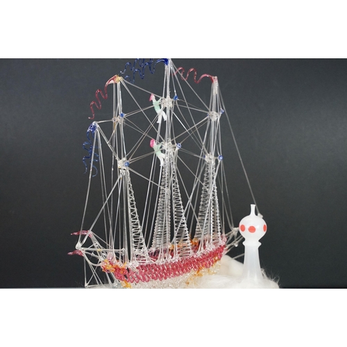 146 - 19th Century Victorian glass frigger sailing ship diorama having a glass blown ship upon a bed of wa... 