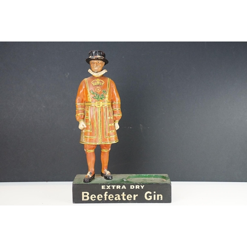 150 - Extra Dry Beefeater Gin countertop advertising figure raised on a plinth base with vacancy for gun b... 