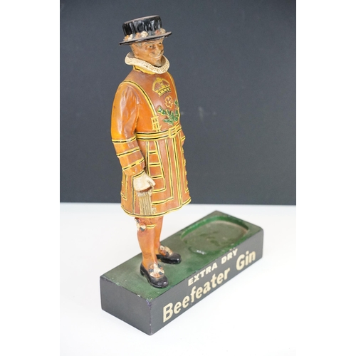 150 - Extra Dry Beefeater Gin countertop advertising figure raised on a plinth base with vacancy for gun b... 