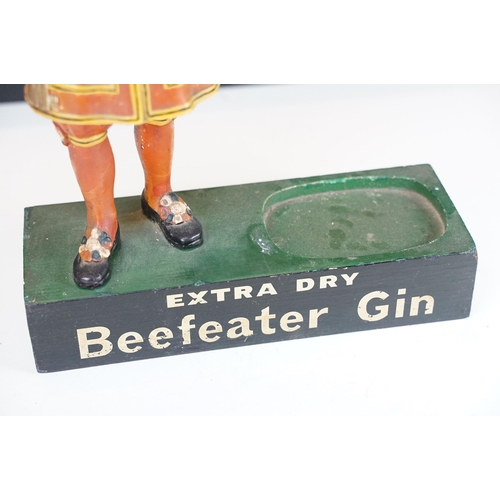 150 - Extra Dry Beefeater Gin countertop advertising figure raised on a plinth base with vacancy for gun b... 