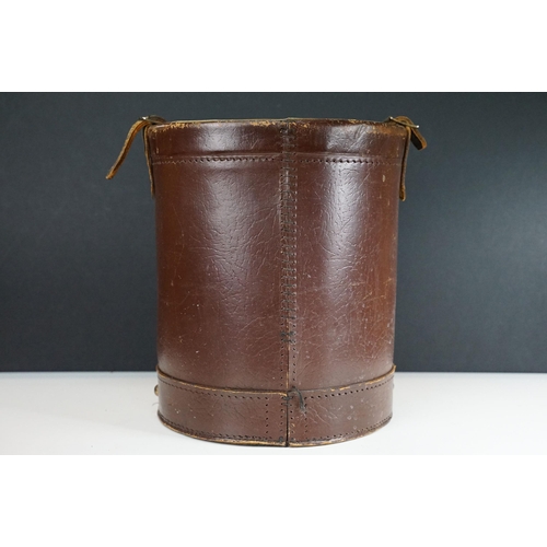 151 - Reproduction cordite bucket coal scuttle having a leather case with printed coat of arms to the fron... 