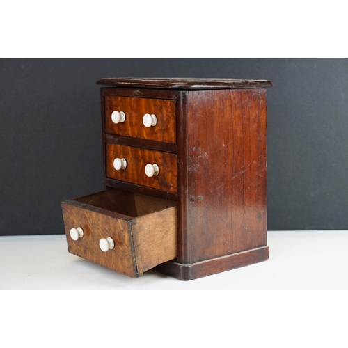 158 - late 19th / early 20th Century apprentice miniature chest of drawers with ceramic knob handles.