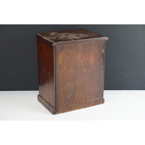 158 - late 19th / early 20th Century apprentice miniature chest of drawers with ceramic knob handles.