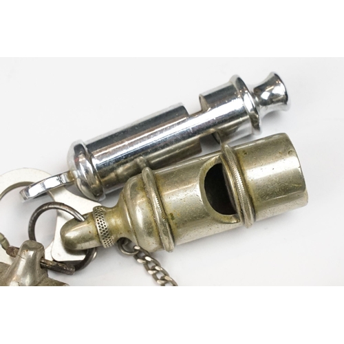 190 - A collection of seven vintage whistles to include the Acme Thunderer and the Metropolitan examples.