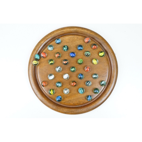 199 - Vintage wooden solitaire board with 35 glass marbles, board 25cm diameter