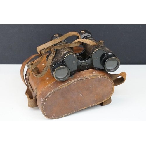 200 - A pair of early to mid 20th century British military field binoculars, marked G. Fournier of Paris, ... 