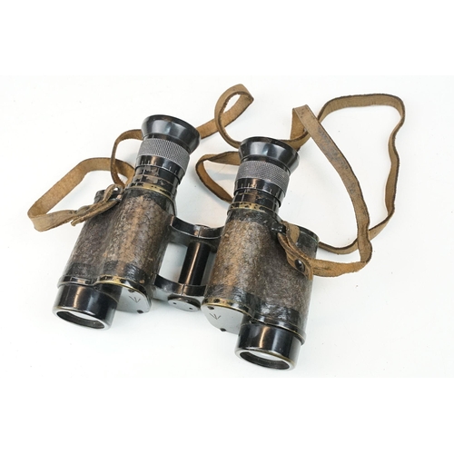 200 - A pair of early to mid 20th century British military field binoculars, marked G. Fournier of Paris, ... 