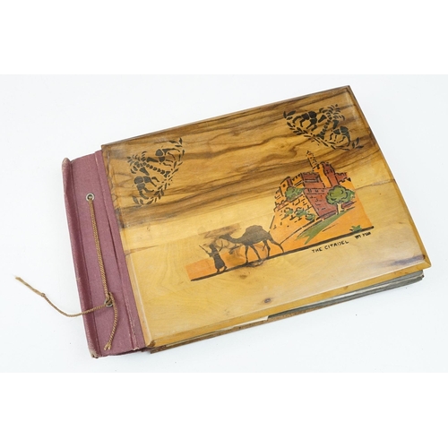 212 - A mid 20th century Israel olive wood photograph album with depiction of the Citadel in Jerusalem to ... 