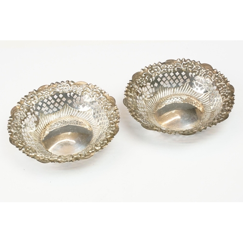 215 - A pair of fully hallmarked sterling silver bonbon dishes with pierced decoration together with a col... 