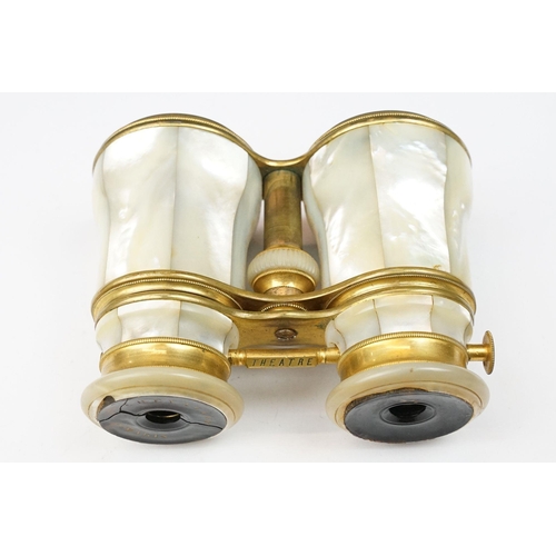 216 - A pair of gilt metal and mother of pearl multi purpose binoculars by Chevalier of Paris, three setti... 