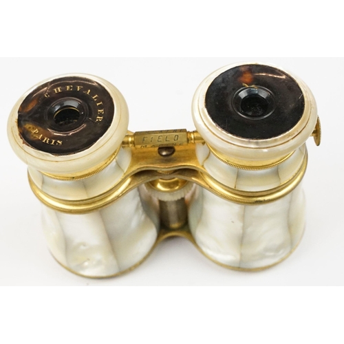 216 - A pair of gilt metal and mother of pearl multi purpose binoculars by Chevalier of Paris, three setti... 