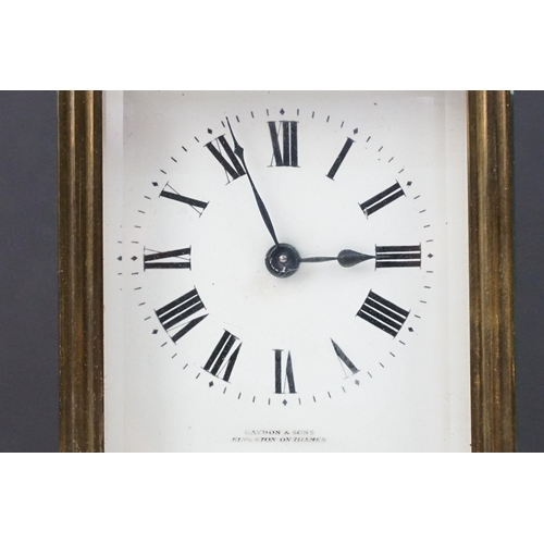 219 - An antique French brass cased carriage clock with bevelled glass panels, retailer marked for Gaydon ... 