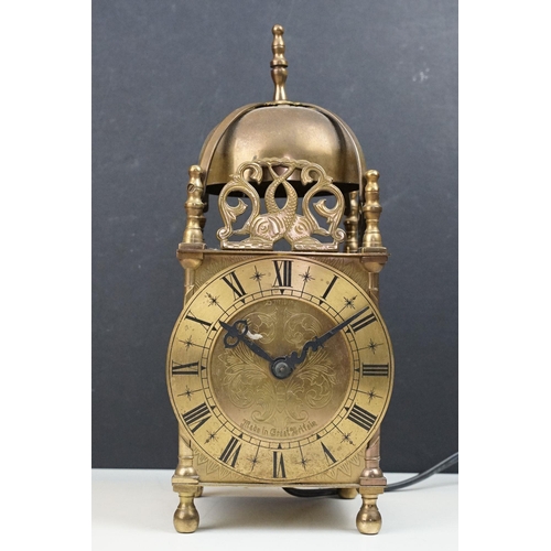 220 - A Vintage brass cased Smiths lantern clock with electric movement.