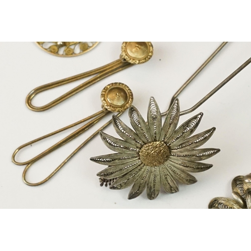 224 - A collection of white metal and gilt filigree costume jewellery to include earrings, bracelets and p... 