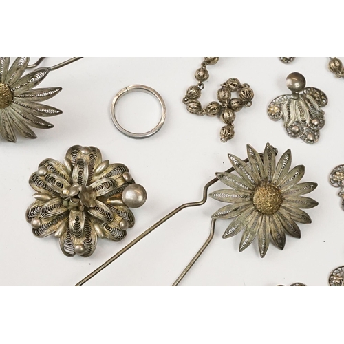 224 - A collection of white metal and gilt filigree costume jewellery to include earrings, bracelets and p... 