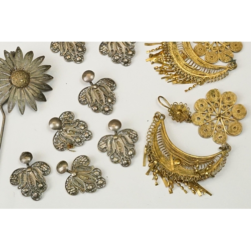 224 - A collection of white metal and gilt filigree costume jewellery to include earrings, bracelets and p... 