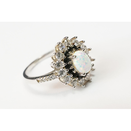 226 - A ladies dress ring with opal to centre, marked S925 to the inner shank.