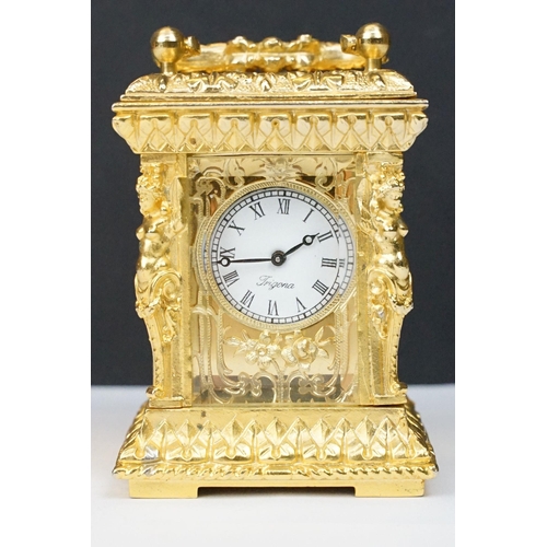 228 - 19th century style French Rococo carriage clock with key