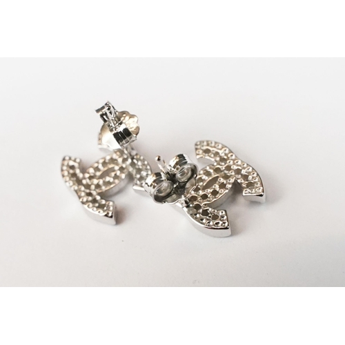 229 - Pair of silver and CZ designer style stud earrings