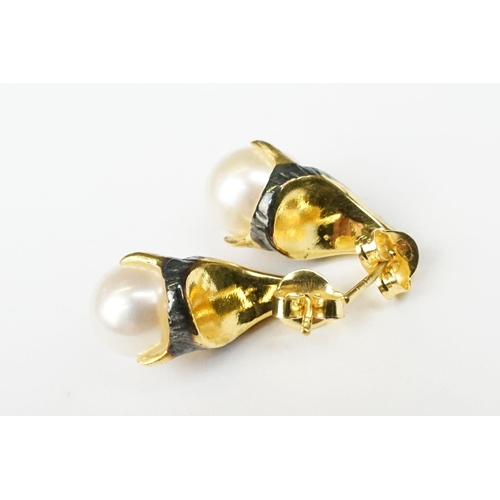 234 - Pair of cultured pearl and enamel stud earrings