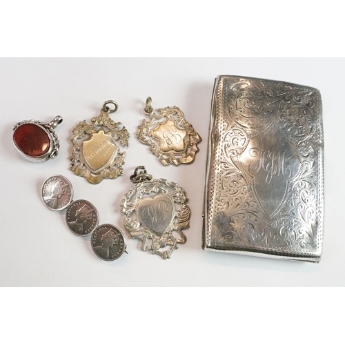 256 - An antique fully hallmarked sterling silver cheroot holder together with a silver fob medal, spinnin... 