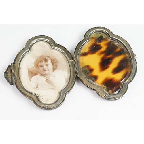 267 - A fully hallmarked sterling silver and faux tortoiseshell folding miniature photograph frame.