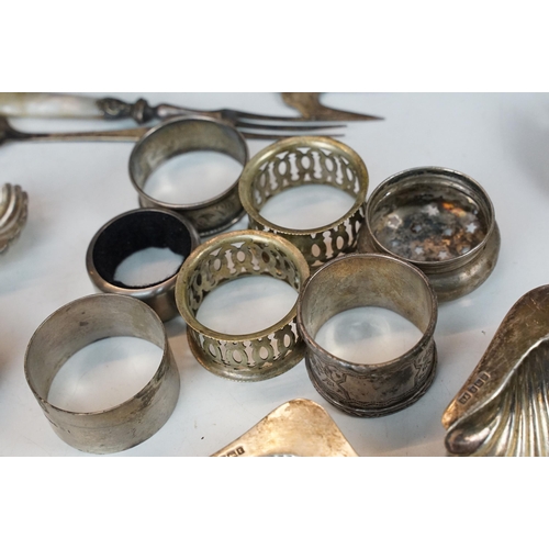 300 - A collection of fully hallmarked sterling silver and silver plate to include scalloped dishes, napki... 