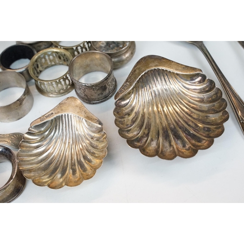 300 - A collection of fully hallmarked sterling silver and silver plate to include scalloped dishes, napki... 