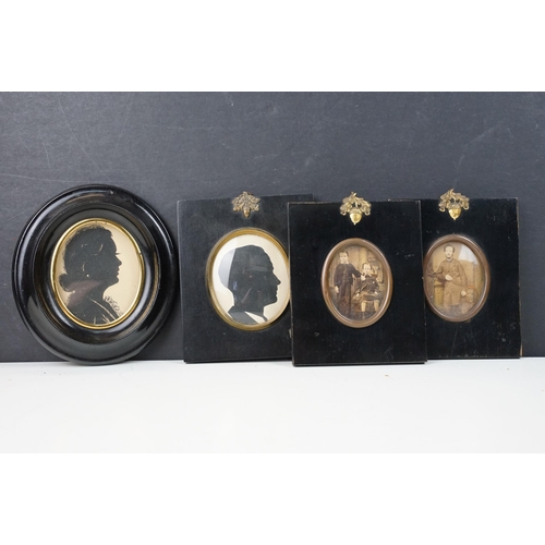 316 - Pair of late 19th century ebonised frames, each surmounted with gilt metal acorn and leaves mount, e... 