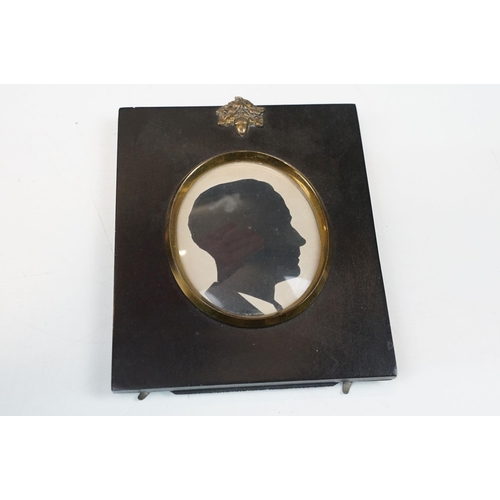 316 - Pair of late 19th century ebonised frames, each surmounted with gilt metal acorn and leaves mount, e... 