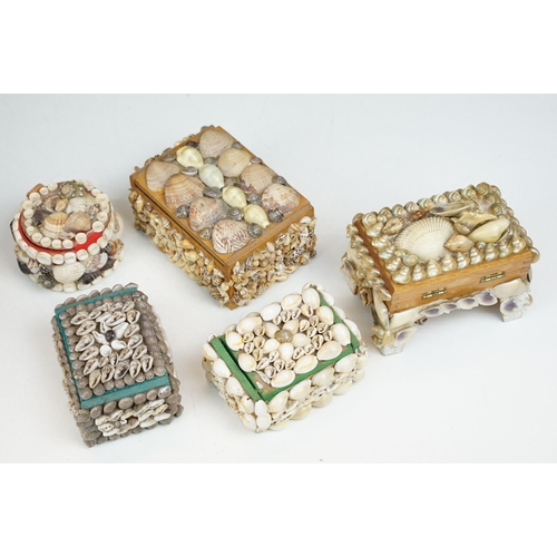 321 - A collection of five vintage hand decorated shell encrusted trinket boxes.