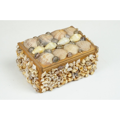 321 - A collection of five vintage hand decorated shell encrusted trinket boxes.