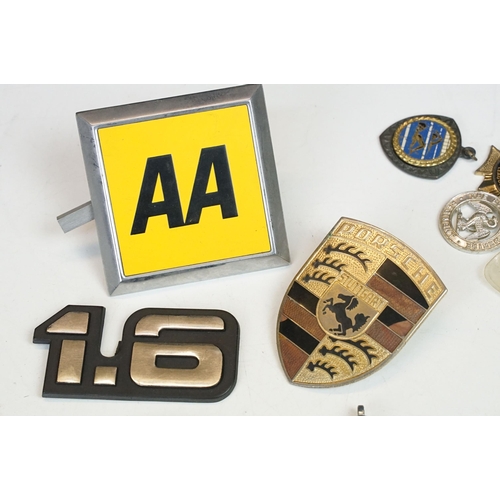 324 - A collection of car badges to include Mercedes, Land Rover, Porsche and Rover examples together with... 