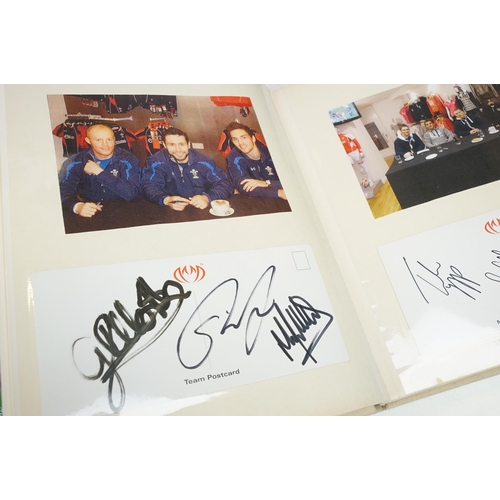 326 - A group of Welsh Rugby collectables to include an album of ephemera to include signed photos and pos... 