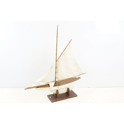 329 - Vintage wooden decked pond yacht, hand painted, L 60cm, with stand