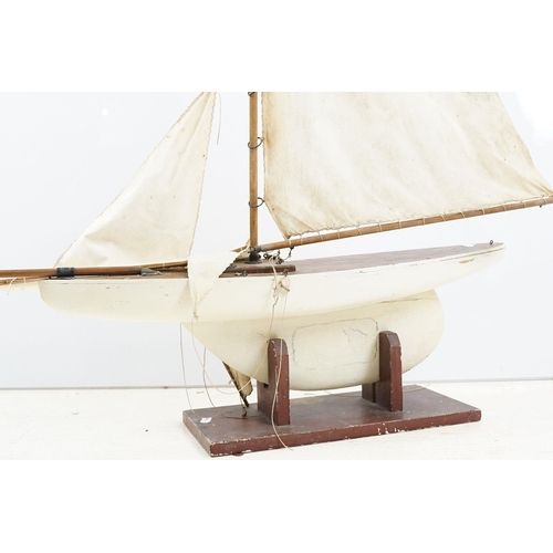 329 - Vintage wooden decked pond yacht, hand painted, L 60cm, with stand