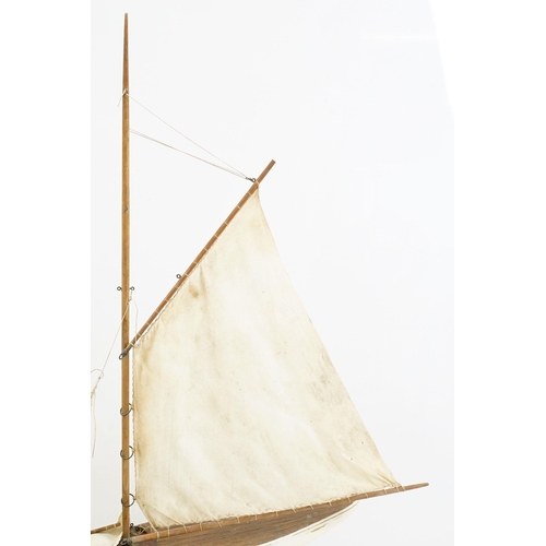 329 - Vintage wooden decked pond yacht, hand painted, L 60cm, with stand