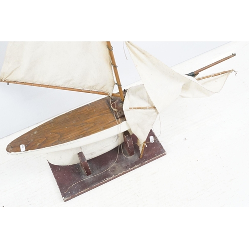 329 - Vintage wooden decked pond yacht, hand painted, L 60cm, with stand