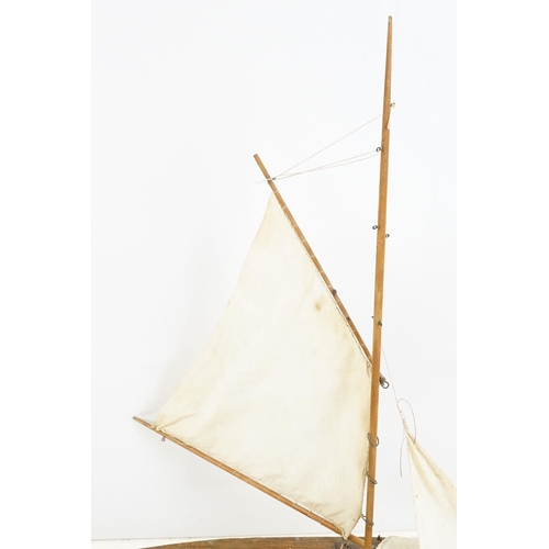 329 - Vintage wooden decked pond yacht, hand painted, L 60cm, with stand