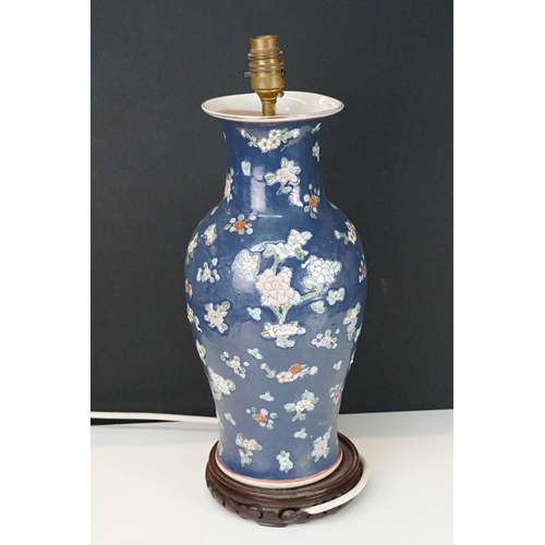 330 - Vintage oriental style floral baluster table lamp base atop a carved wooden base stand, H 40cm