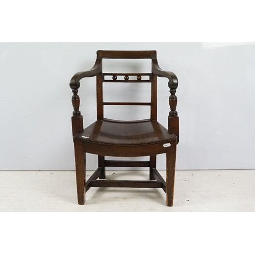 335 - 19th century mahogany child's chair with scroll arms, carved ball and bar back, curved solid seat on... 