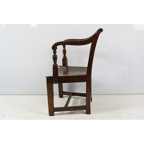 335 - 19th century mahogany child's chair with scroll arms, carved ball and bar back, curved solid seat on... 